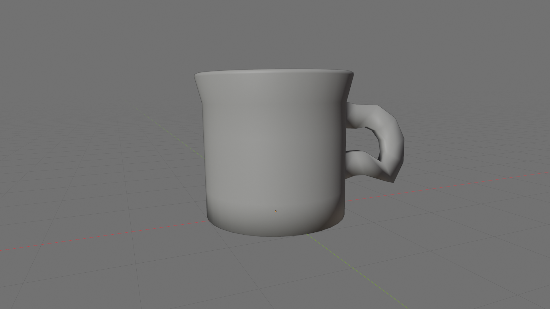 Slightly angled perspective view of the finished coffee mug in Object Mode resting on the grid floor, with a small origin marker at the bottom-center where the red X and green Y axes cross.