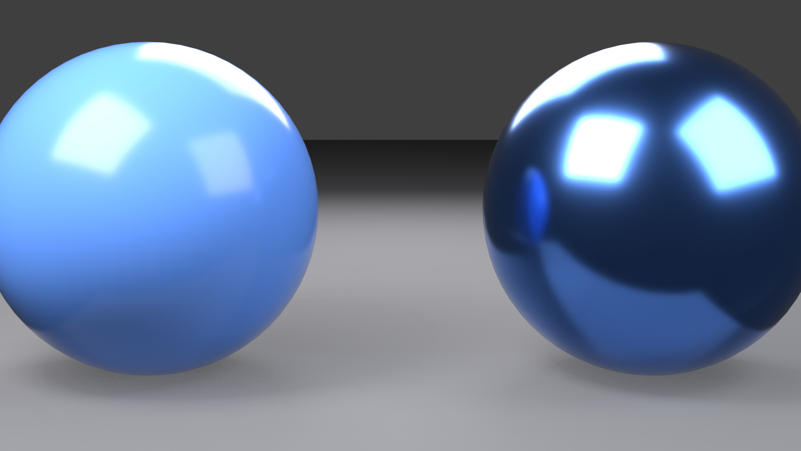 Two identical spheres side by side under the same lighting: the left sphere at Metallic 0.0 shows a bright blue painted surface, the right sphere at Metallic 1.0 shows the same blue only as tinted mirror reflections.