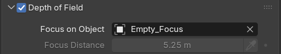 A crop of Blender's Camera Depth of Field panel. The Depth of Field checkbox is enabled, Focus on Object is set to an object named Empty_Focus, and the Focus Distance field below is greyed out because the focus object is driving it.