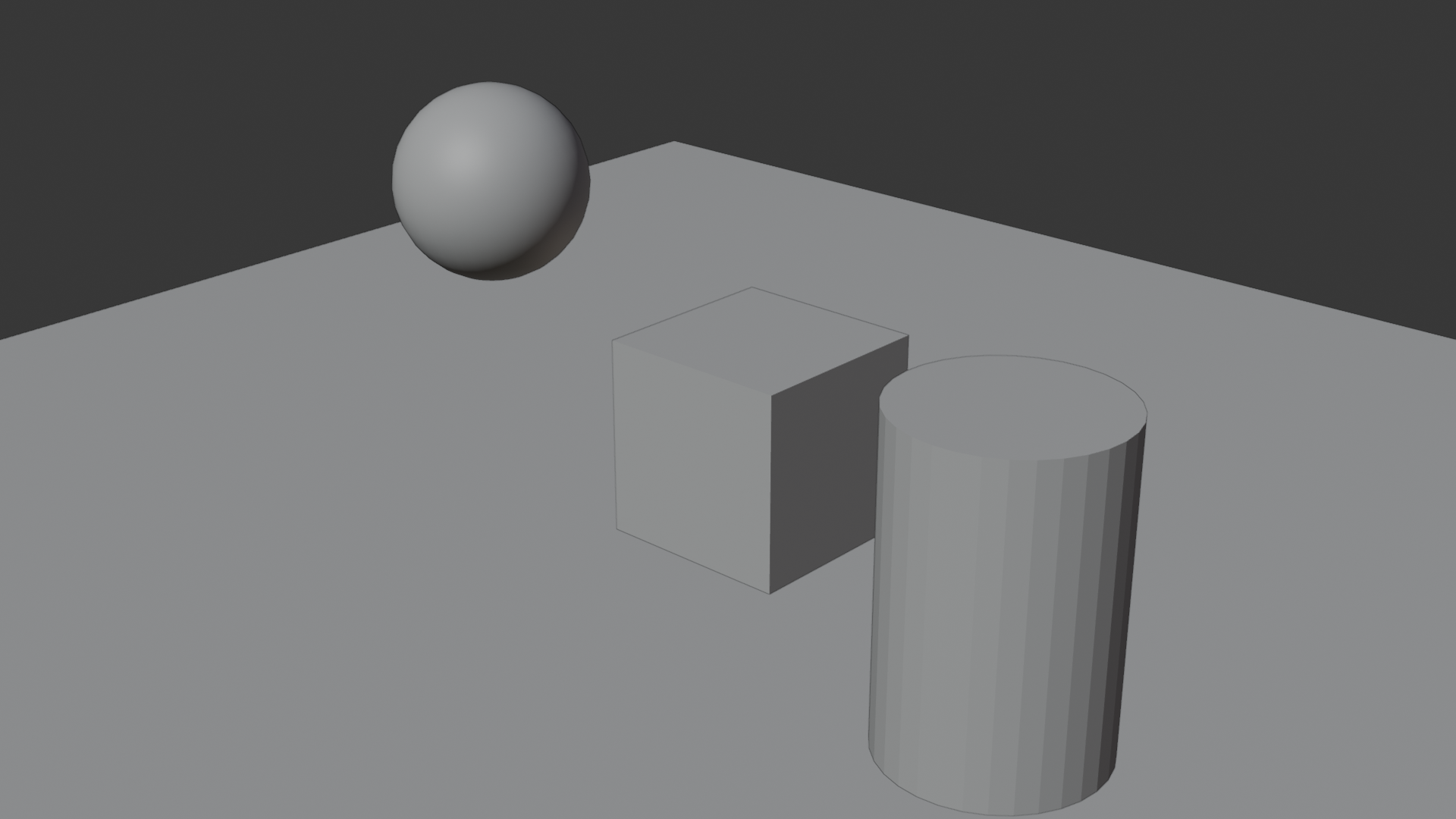 The project scene setup: the ball, cube, and cylinder arranged on a ground plane, each labeled.